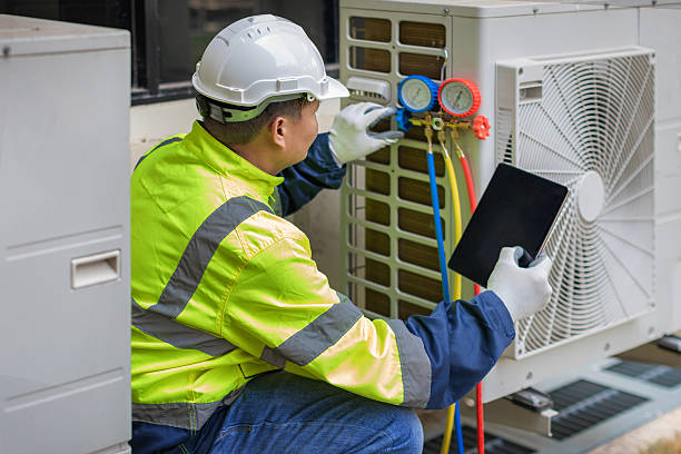 Professional Hvac technician working in Ellendale, DE